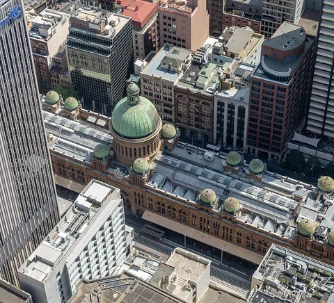 View down from Sydney Tower Eye across the Queen Victoria Building and surrounding CBD streets, 2019.